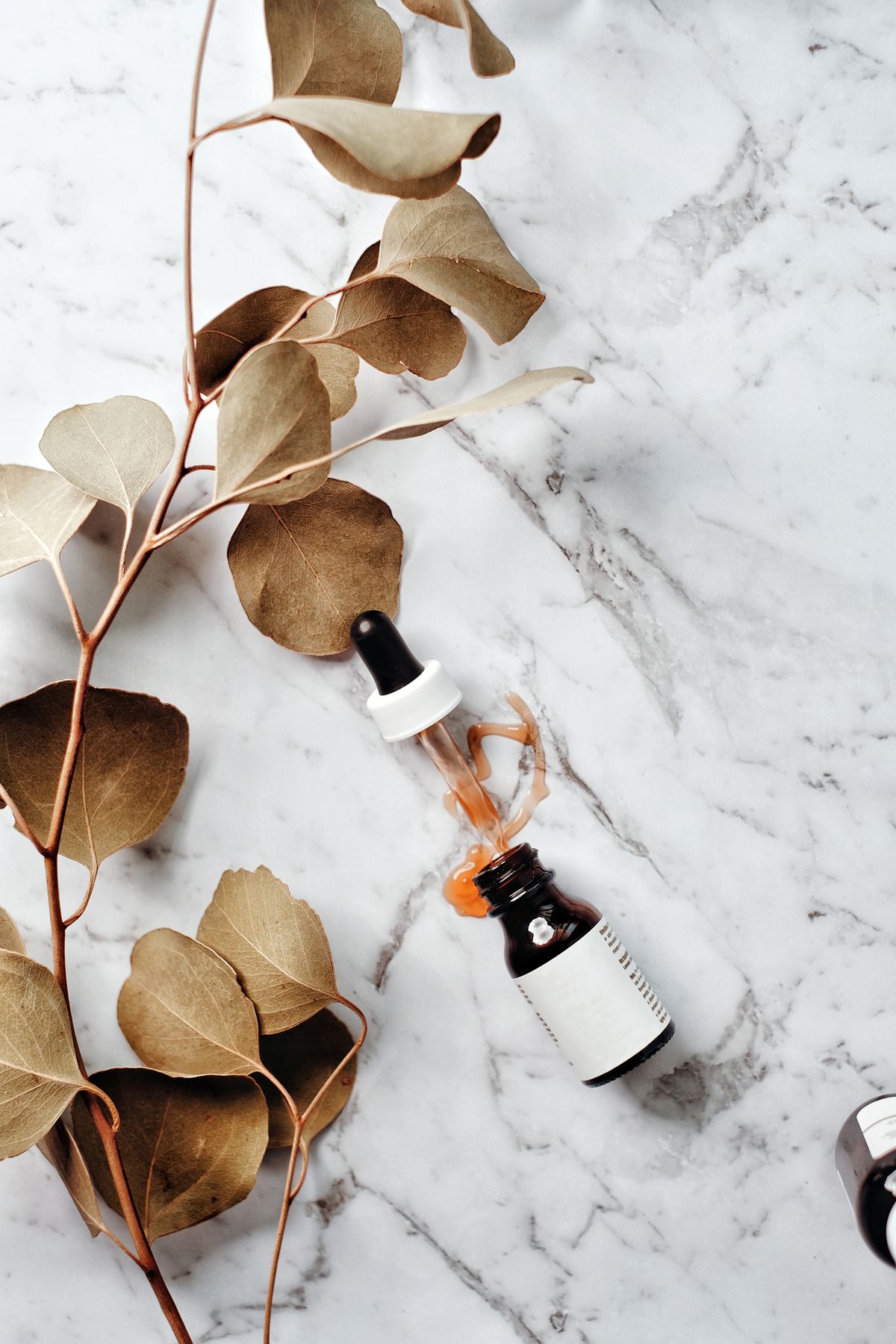 French pharmacy skincare products arranged in a flatlay — the best of the parapharmacie
