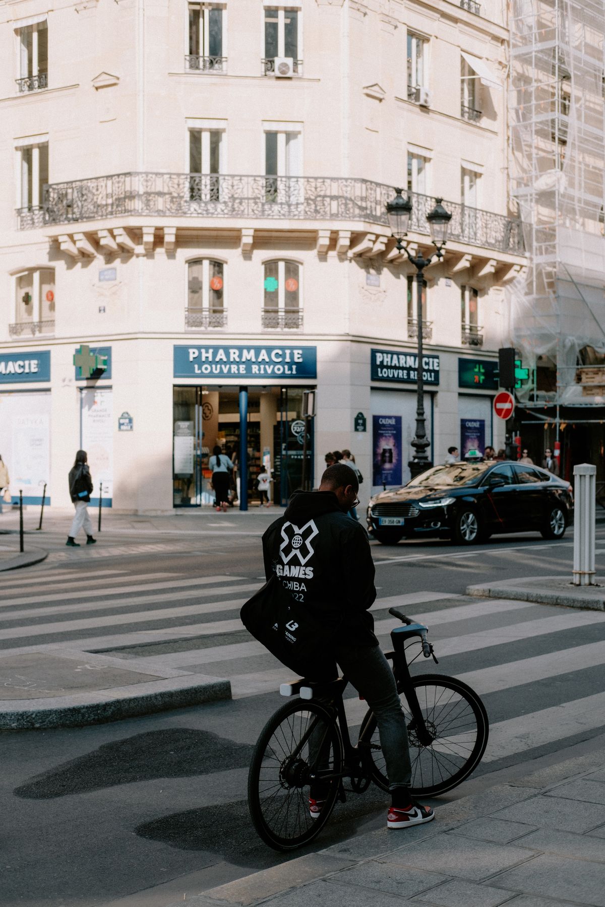 A Parisian pharmacie with its green cross sign — the home of French pharmacy skincare