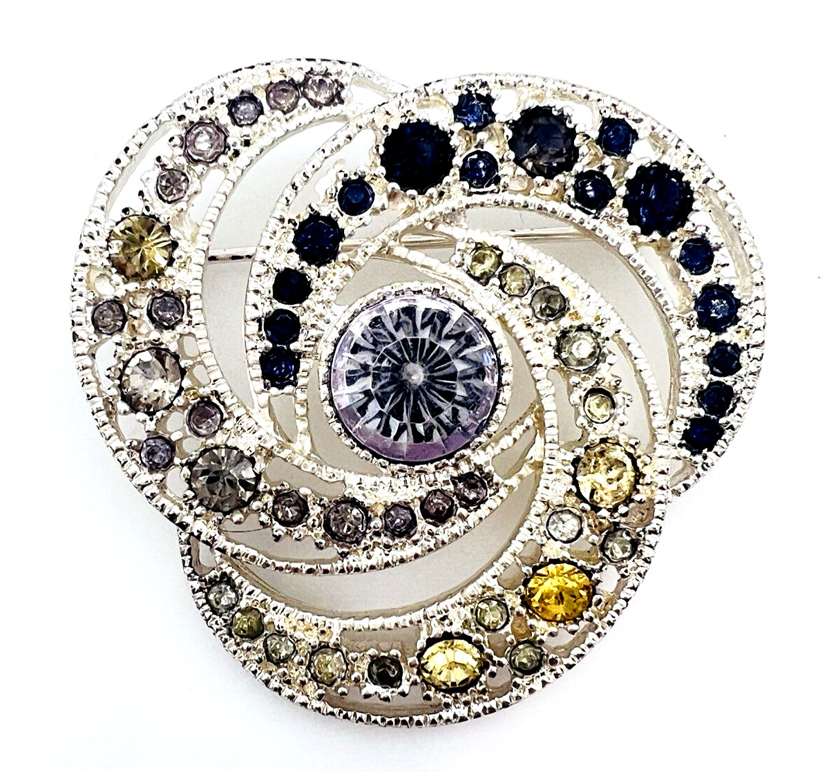 Vintage silver-tone rhinestone swirl brooch